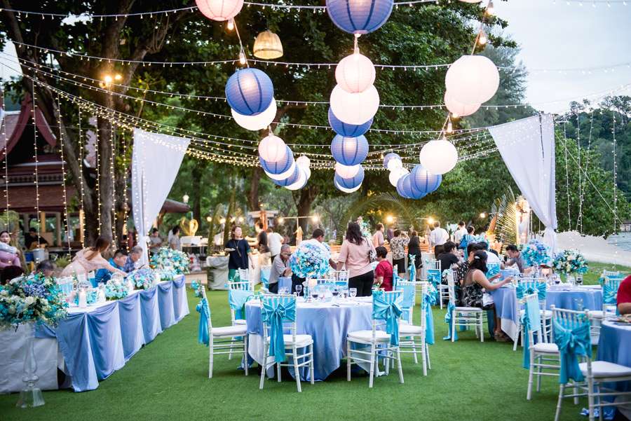 Phuket Dream Wedding Jacquelene & Dickson 15 A beautifully decorated wedding reception in Thailand featuring elegant blue and white themes, creating a serene atmosphere.