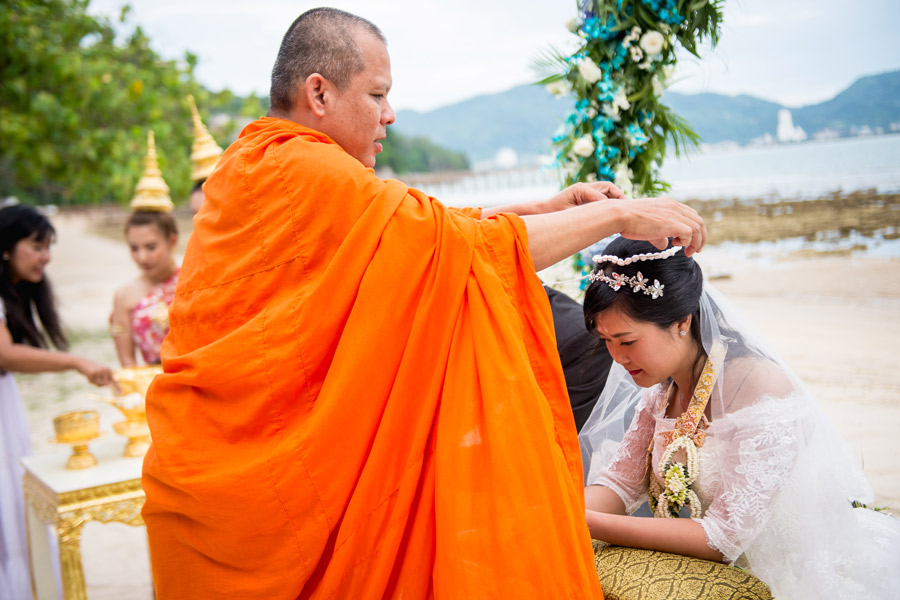 Extra Services Monk Blessing A monk arranges a bride's hair at a Thai wedding ceremony in Phuket arranged by Phuket Dream Weddings.